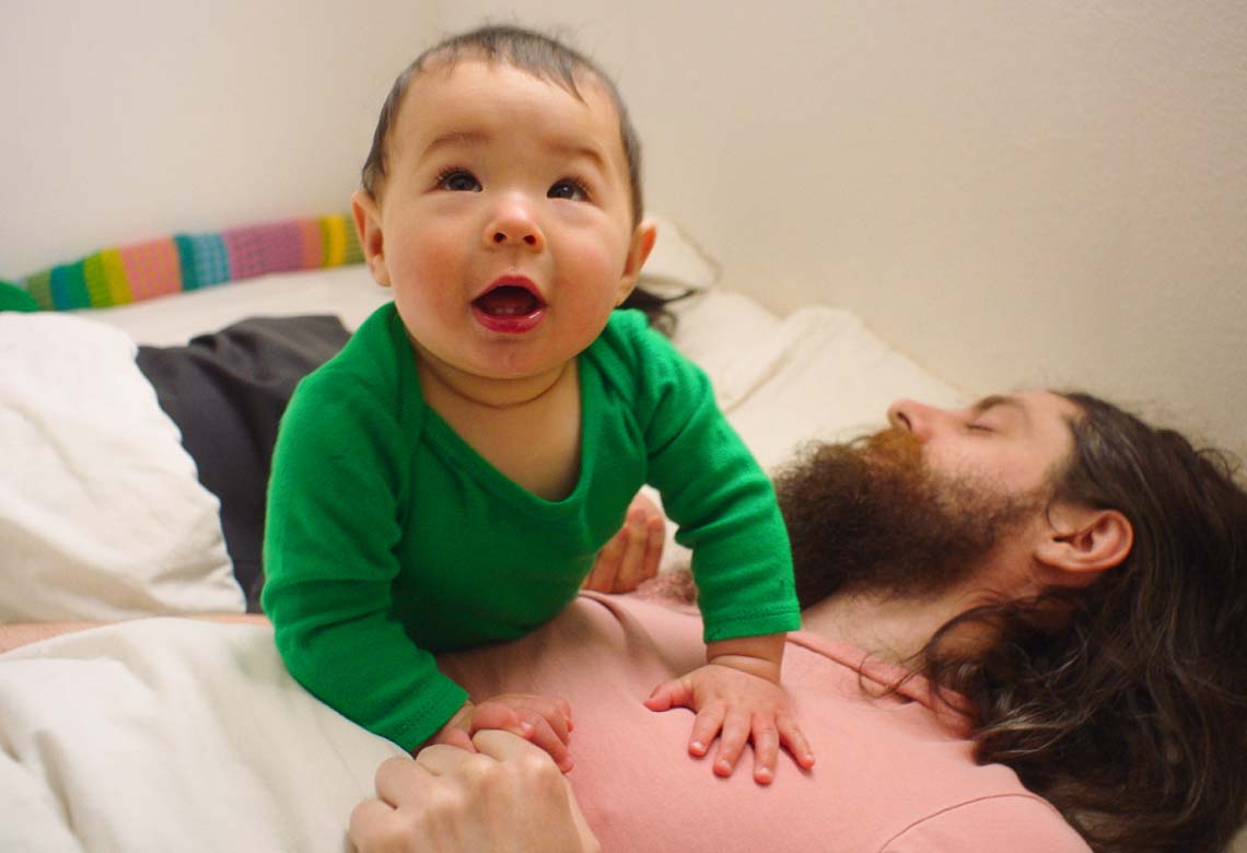 a baby in bed with parents